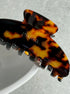 Tortoiseshell hair clip on a light gray background large claw clip for hick hair eco friendly acetate hair accessory 