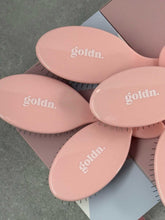 Load image into Gallery viewer, Pink hairbrushes with &#39;goldin.&#39; branding on a gray surface
