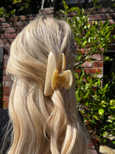 Load image into Gallery viewer, Close-up of a person with blonde hair wearing a beige hair clip outdoors.

