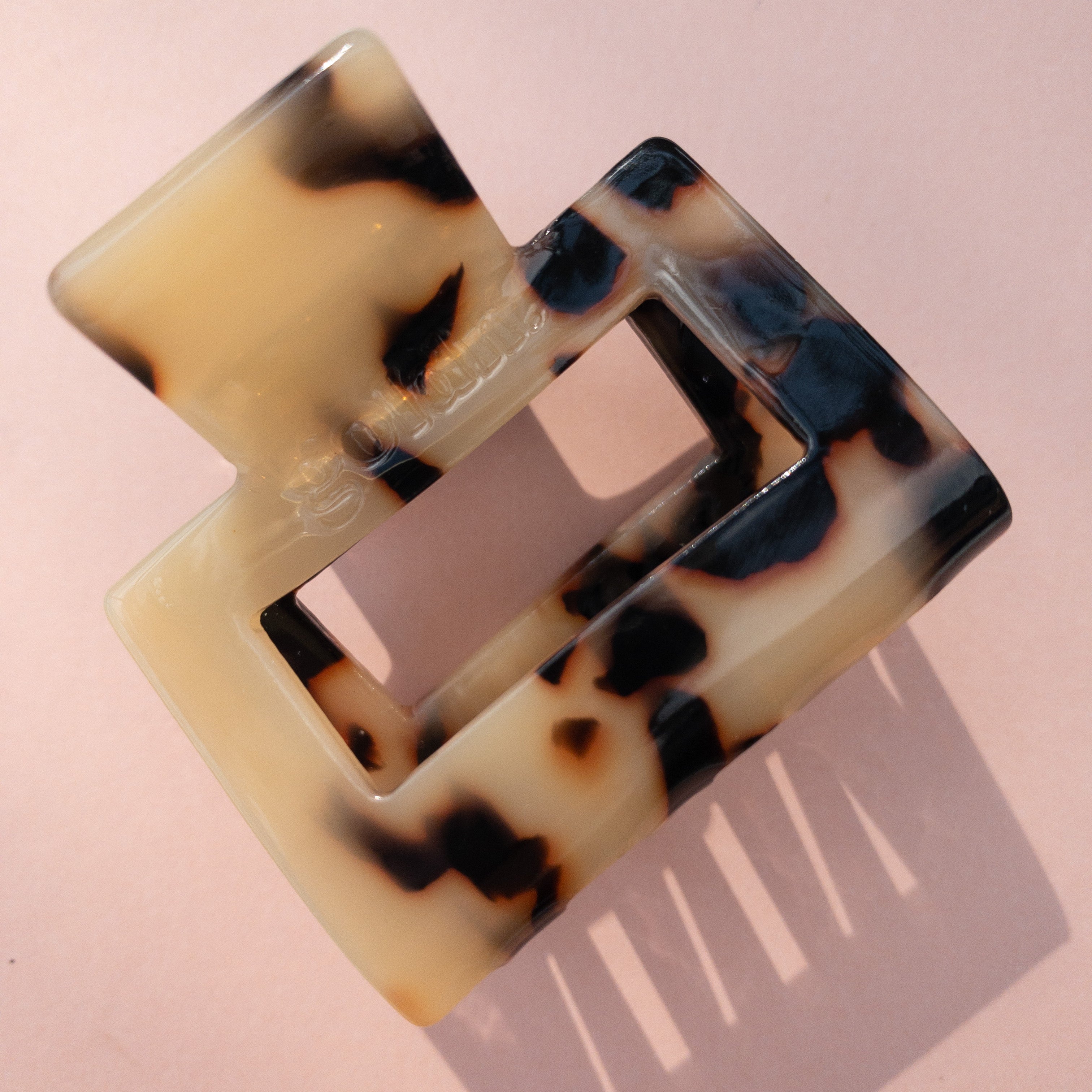 Lounge Claw Clip Small in tortoiseshell pattern with glossy finish, ideal for stylish, everyday hair accessorizing.