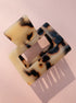 Lounge Claw Clip Small in tortoiseshell pattern with glossy finish, ideal for stylish, everyday hair accessorizing.