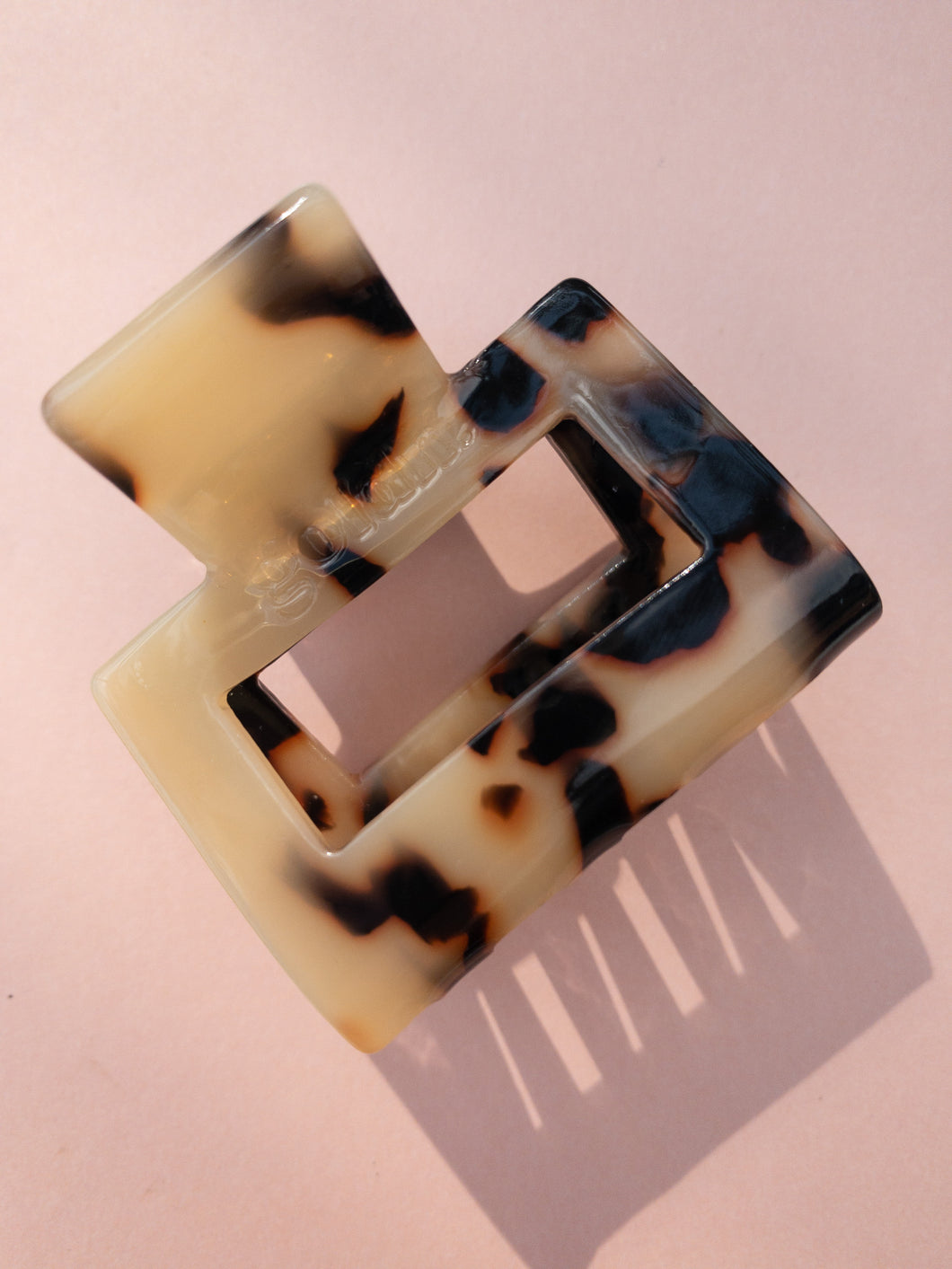 Lounge Claw Clip Small in tortoiseshell pattern with glossy finish, ideal for stylish, everyday hair accessorizing.